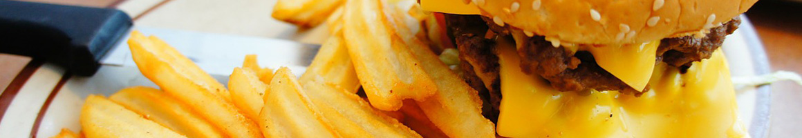 Eating American (Traditional) Burger at Snuffers restaurant in Rockwall, TX.